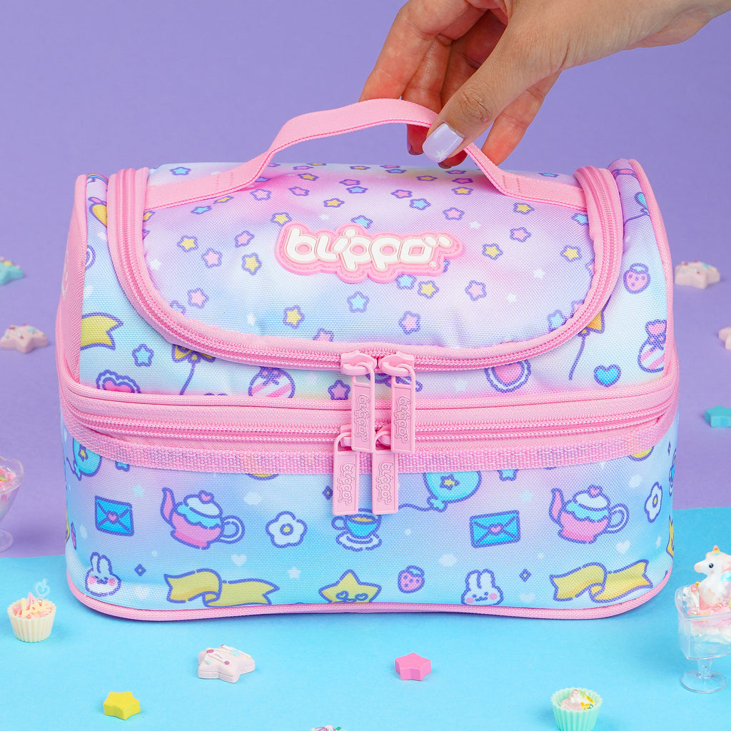 Woman holding a cute pink insulated lunch box designed for girls and featuring kawaii designs for school.