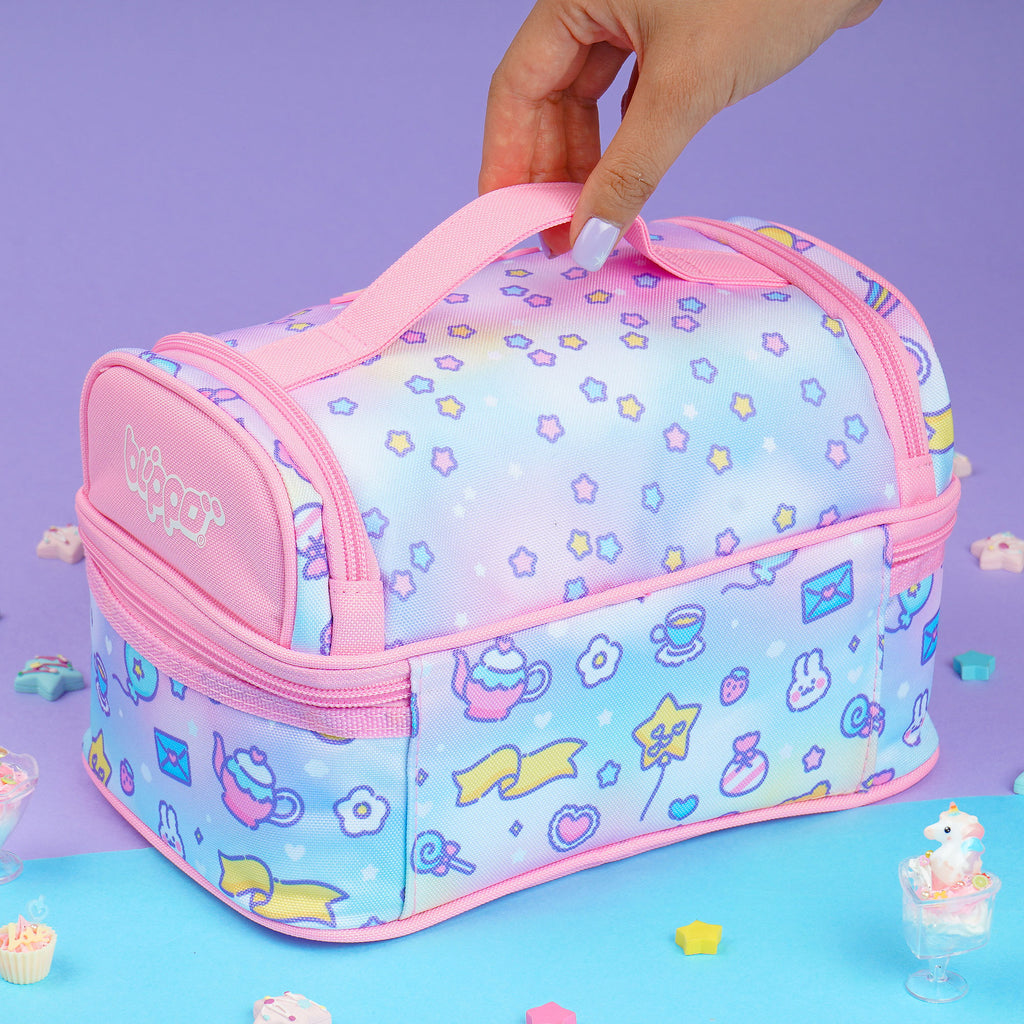 Woman holding a pink insulated lunch box designed for girls and featuring cute kawaii designs for school.