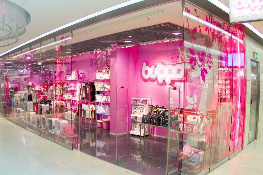 Blippo store interior with pink walls and product displays.