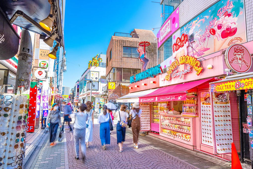 Colorful Harajuku street scene with shops and people in a vibrant urban setting
